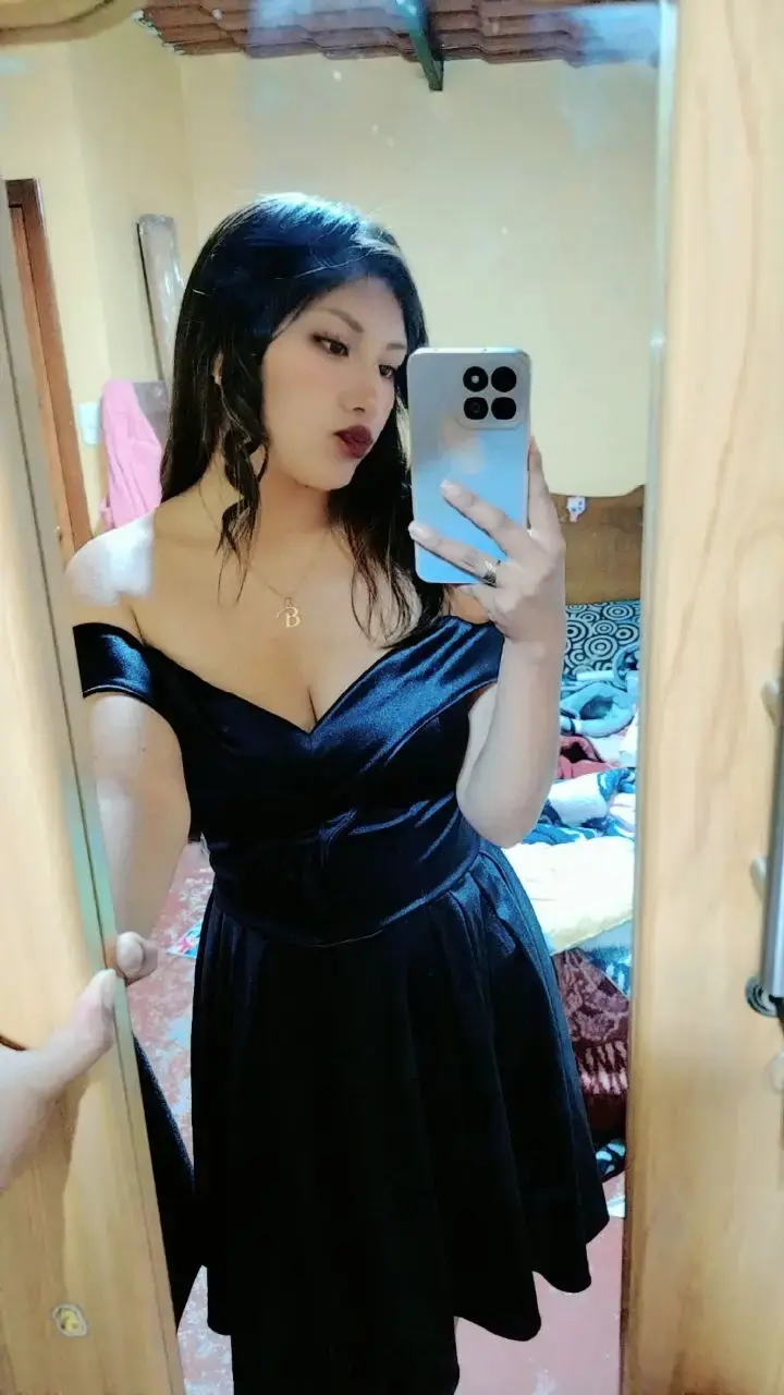 Portrait-orientation, medium-long shot of Subject[Person in the Image] standing in torrential rain at night, arms flung wide with open palms, spine arched and chest lifted, head tipped back toward the downpour; low-angle 3/4 profile (~20° up). Composition: Subject centered with a slight left bias, generous headroom and surrounding negative space, diagonal rain streaks slashing across the frame as leading lines, symmetrical arm span forming strong triangular shapes, clean featureless background; crop near shins. Camera: Canon EOS 5D Mark IV (full-frame) + 50 mm, f/2.8, 1/60 s, ISO 800, white balance 3200 K; static/tripod. Lighting: single warm backlight high at 3/4 back-right creating a bright rim on jaw/arms and lighting the rain, minimal/no fill. Environment: exterior night in heavy rain with a dark background and backlit spray. Color grade: cinematic warm amber with deep blacks, moderate saturation, slightly warm temperature. Mood: cathartic, exultant, freedom. Aspect ratio 2:3. Post: S-curve contrast, clarity/micro-contrast to emphasize rain streaks, subtle vignette, mild noise reduction. Negative prompts: watermark, text artifacts, banding, oversoften skin, extra limbs, warping, blown highlights, HDR halos, plastic look.