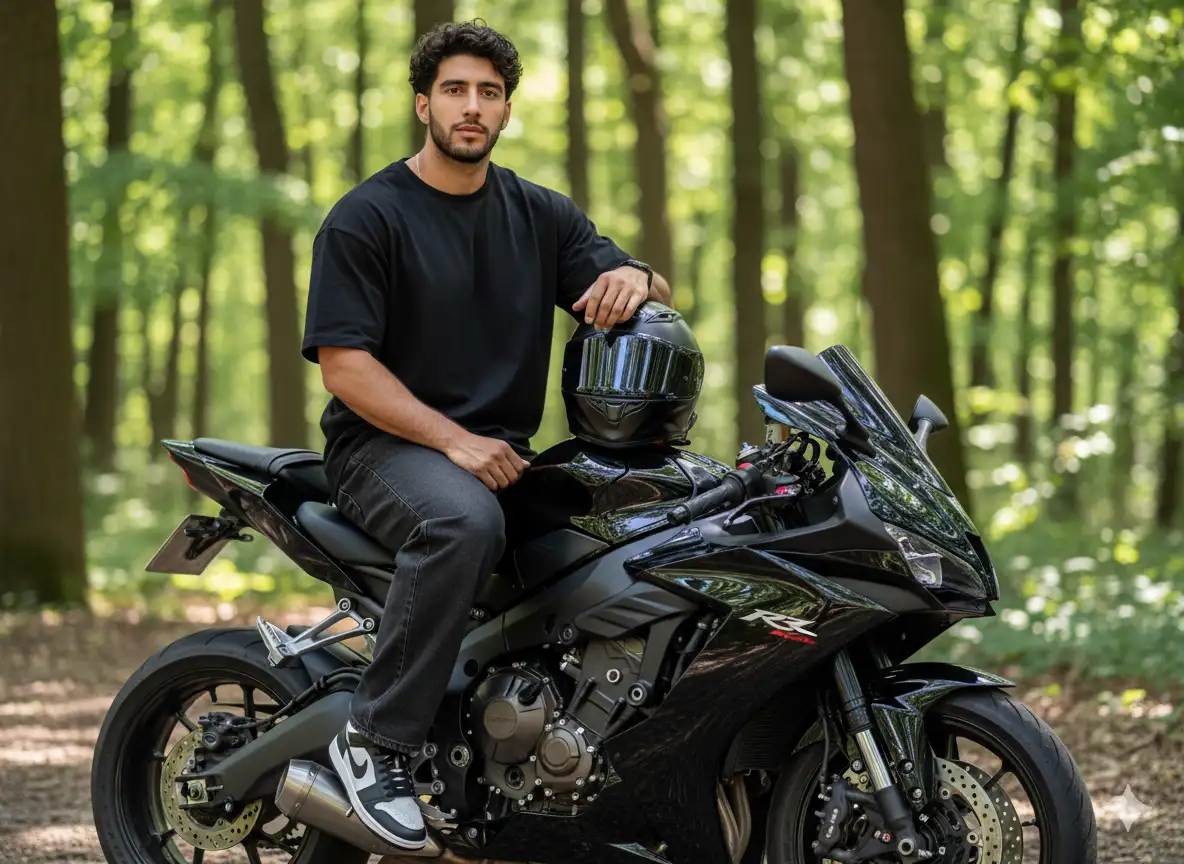 Create an image of me [photo attached] as an ultra-realistic portrait. I'm sitting on a shiny black sports bike outdoors against a backdrop of green trees. I'm wearing a loose black t-shirt, loose dark jeans with cuffs at the bottom, and black and white Nike sneakers. Accessories include a black watch. My left hand rests casually on my thigh, while my right hand rests on the bike, holding a shiny black helmet with a clear visor.
The bike looks detailed with a large engine, a strong frame, and shiny chrome details, accentuating the modern and powerful impression. The background features tall trees with soft natural light, creating a balanced blend of shadow and light. The expression is calm and confident, looking directly at the camera.
The overall style is cinematic and modern, combining the feel of youthful streetwear with the presence of a bold motorcycle. High-resolution, photorealistic editorial style.